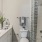 Soaking tub and single vanity in model unit apartment bathroom at The Oakley at Saraland