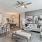 Apartment kitchen opening up to living room in homes at The Oakley at Saraland