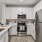 a kitchen with white cabinets