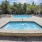 Resort-style jacuzzi next to community pool at The Oakley at Saraland