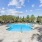Resort-style swimming pool with a waterfall at The Oakley at Saraland